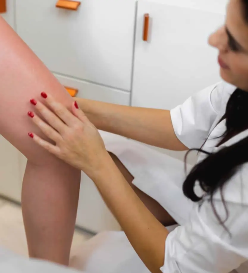 dermatologist checking leg